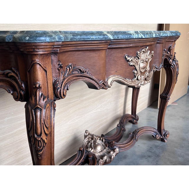 20th French Regency carved walnut console table with gilted edges 20th century French Regence style beautifully carved...