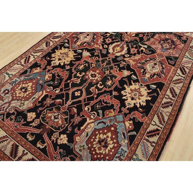 An authentic vintage traditional Heriz rug hand-knotted with fine wool on a cotton foundation. This rug features a...