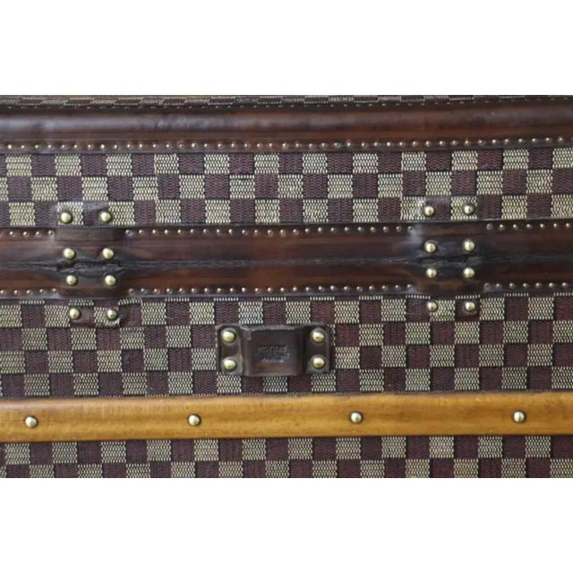 This beautiful and very rare Moynat trunk features beautiful checkers canvas, chocolate color leather trim, large leather...
