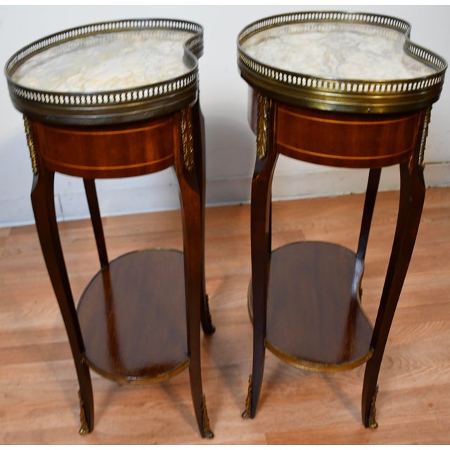 We are pleased to offer this beautiful Antique pair of French Nightstands, from the 1930. This pair is made of Mahogany...