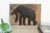 This carved wooden panel, depicting a powerful elephant, originate from Thailand and likely date to the mid-20th century...