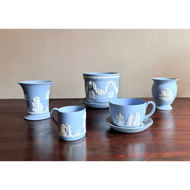 Wedgwood blue Jasperware demitasse cup and saucer set in classic unglazed matte stoneware with white neoclassical relief....