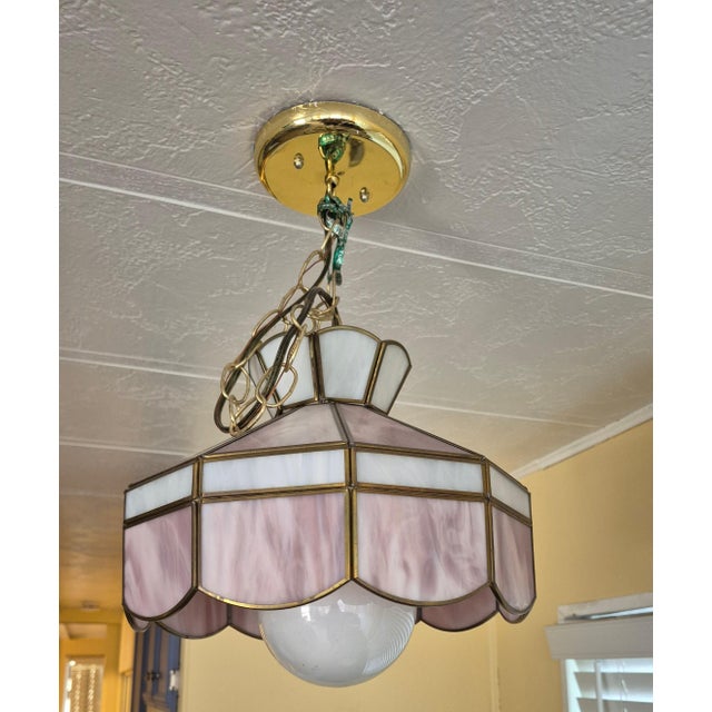 This is a vintage 1970s–1980s Tiffany-style slag glass pendant lamp featuring an 8-panel design composed of pearly, satin-...