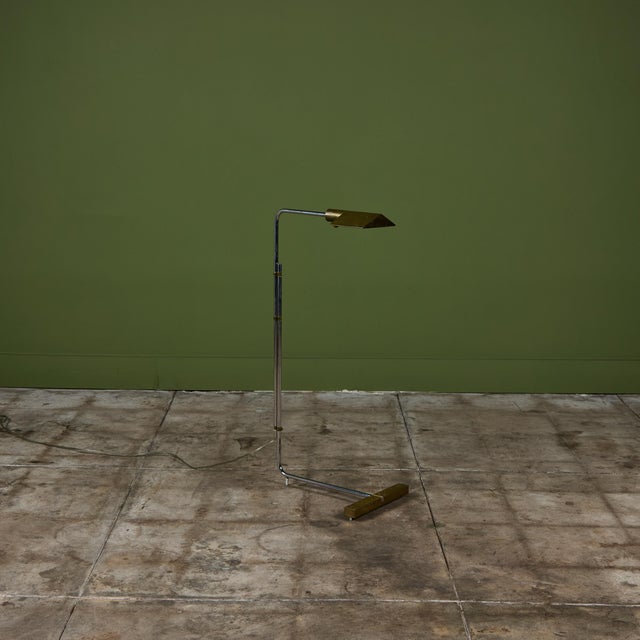 Designed in the 1970s, this brass and stainless steel floor lamp by Cedric Hartman is an enduring design classic. The...