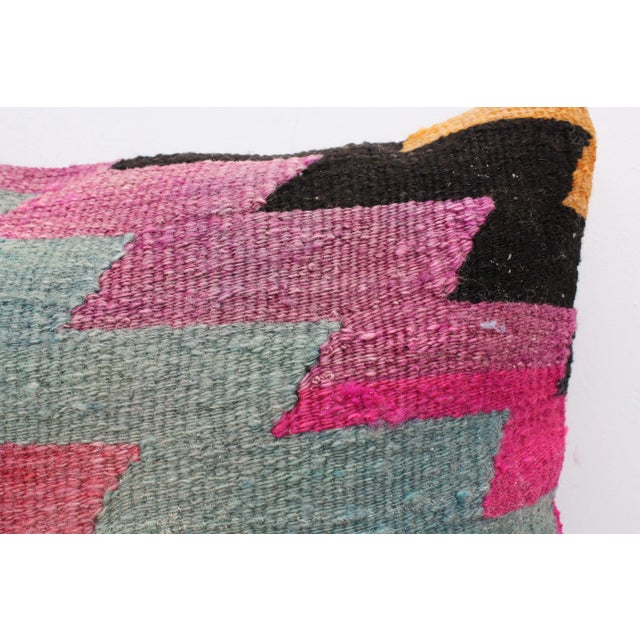 This Turkish pillow cover is made from the highest quality Vintage Kilim in 100% wool on the front. The back is covered in...