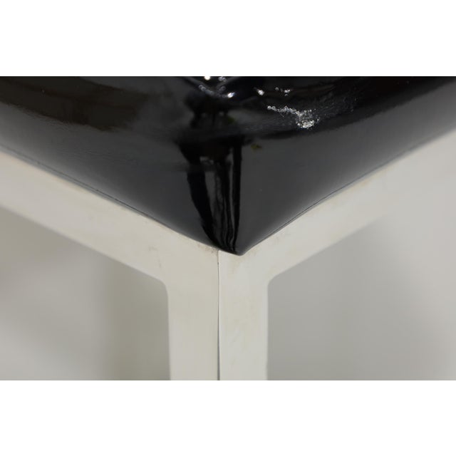 Great looking set of six bar stools. Milo Baughman style. Upholstered in black patent leather with quality chromed frames.