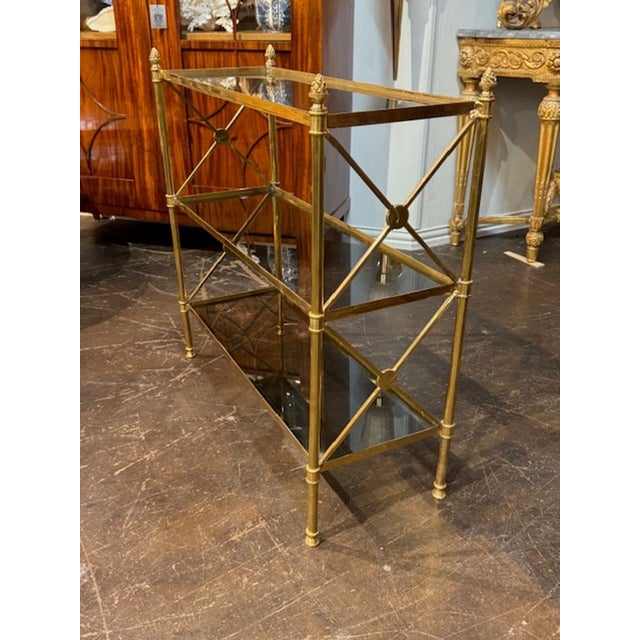 Italian Jansen design polished brass etagere table. Italian Jansen design étagère tables are elegant mid‑20th century...