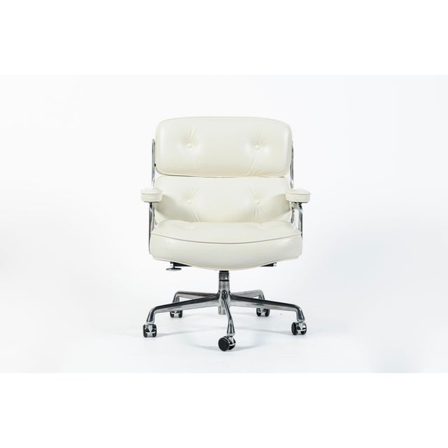 This white Model 3475 Eames Time Life Executive Lobby Chair designed by Charles & Ray Eames for Herman Miller was produced...