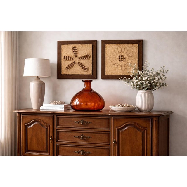 A beautifully formed vintage glass demijohn-style vase, handcrafted in Spain and finished in a rich amber-tangerine tone...