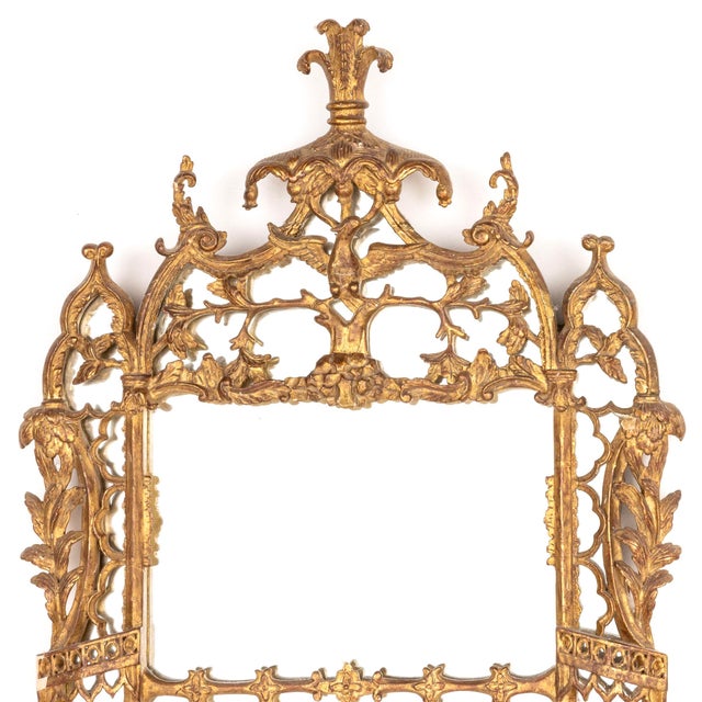 Richly detailed George III Style Giltwood Mirror. The rectangular divided mirror plate is set within an elaborately carved...