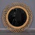 This Italian wall mirror from the 1950s showcases the artisanal rattan work that defined Mediterranean modernism. The...