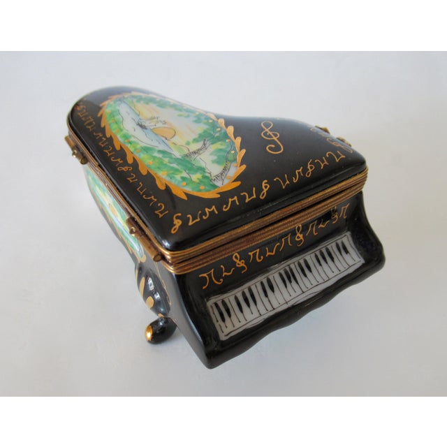 C.1990's; Limoges, France, hand-painted Rochard "Baby Grand Piano," Trinket box, with brass ribbon metal clasp and...