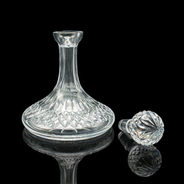 This is a vintage ship's decanter. An English, cut crystal glass full bodied wine or spirit vessel, dating to the mid 20th...