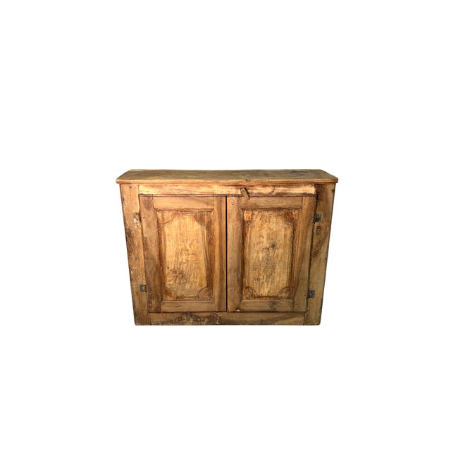 Antique 19th-century sideboard made of poplar and walnut, with two finely decorated doors. Solid and harmonious in...