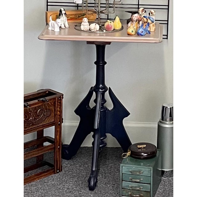 This Early table is solid and has been painted with a white wash top and navy base. See photos of current condition,...