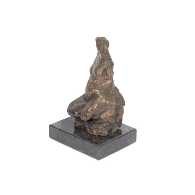 A nude bronze sculpture by Italian artist Costantino Nivola (1911-1988). This sculpture features an abstracted nude figure...