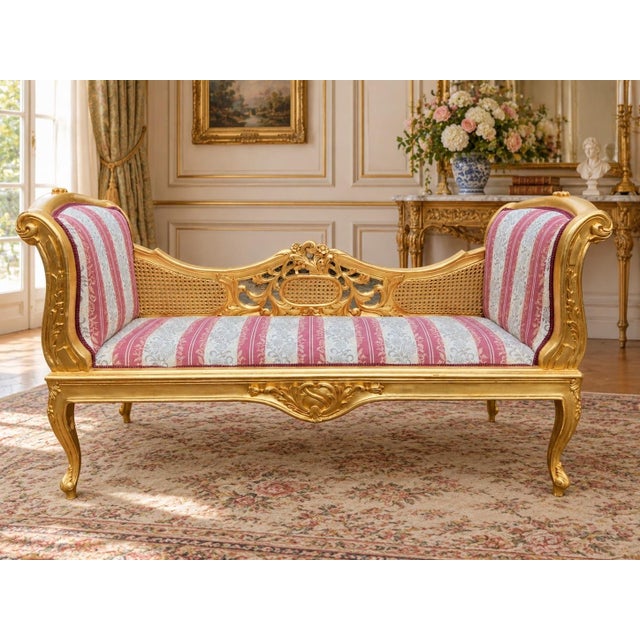 This elegant 1960s French Louis XVI–style settee combines traditional cane work, carved gilt beechwood and soft rose-and-...