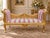 This elegant 1960s French Louis XVI–style settee combines traditional cane work, carved gilt beechwood and soft rose-and-...