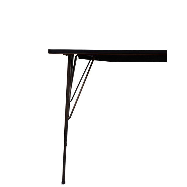 This highly recognizable table by Rudolf Wolf is an iconic piece of Dutch industrialism. Manufactured by Elsrijk in the...