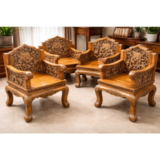 An intricately carved seating group made of solid teak, consisting of four armchairs and a matching coffee table. Balinese...