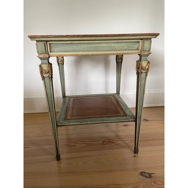 French empire distressed green patina square side table with brown leather inset and painted gold accents. 26 1/4" high 21...