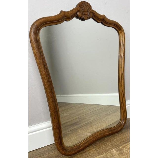 Enhance your home with this elegant Vintage French wall mirror, beautifully crafted in oak with a gracefully shaped frame...