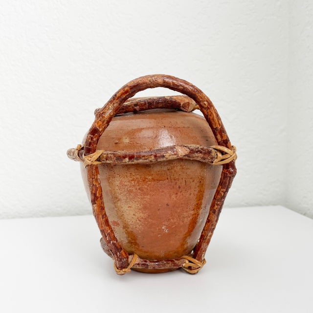 Rare, rustic vintage vase crafted of clay pottery vase or pot wrapped in willow branches and secured with accents of woven...