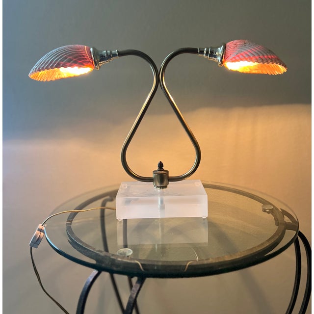 This vintage sculptural table lamp features two genuine natural seashells as shades with a two way switch for medium and...