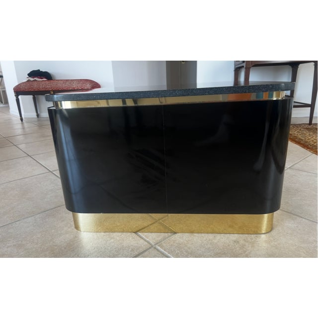 Architectural, glamorous, and effortlessly sophisticated, this striking 1980s Postmodern side table captures the bold...