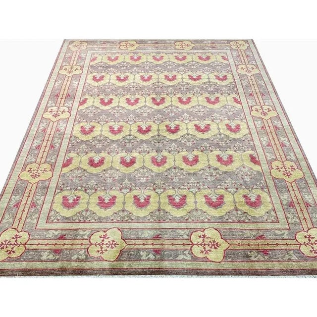 ACTUAL SIZE: 8’10” x 11’10” PRIMARY COLOR: Plum / Multi AGE: New ORIGIN: Pakistan MATERIALS: Wool FOUNDATION: Cotton...