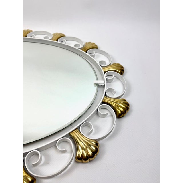 Vintage Curly Metal Brass Shells Eliptical Wall Mirror from Hillebrandt, 1971, in Restored conditions. Designed 1970 to...