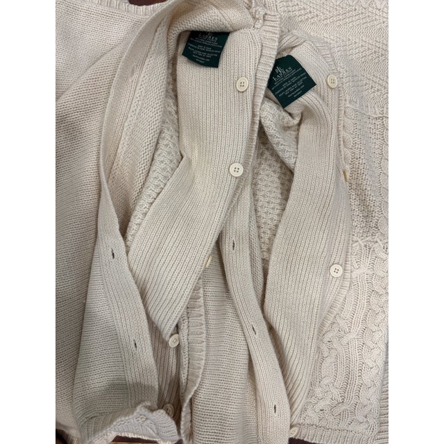 Beautiful pair of Ralph Lauren Home Collection Euro shams featuring an intricate patchwork of classic cable, basketweave,...
