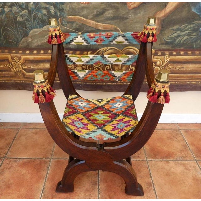Victorian Gothic Revival Oak Savonarola Chair, circa 1860 Material: Country oak and textile upholstery A distinctive...