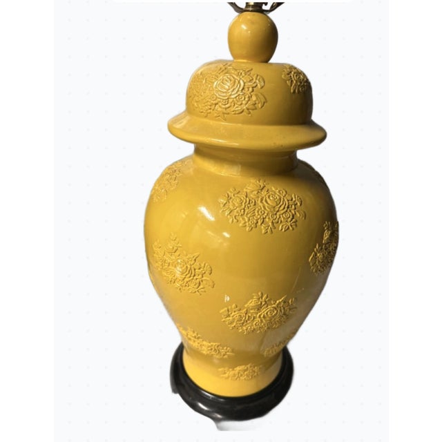 A stunning blend of classic Chinoiserie elegance and modern sophistication, the Embossed Yellow Ginger Jar Lamp on Wood...