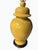 A stunning blend of classic Chinoiserie elegance and modern sophistication, the Embossed Yellow Ginger Jar Lamp on Wood...
