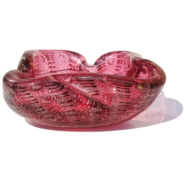 Beautiful vintage Murano hand blown, rich pink with dark spots Italian art glass decorative bowl. The piece has a...