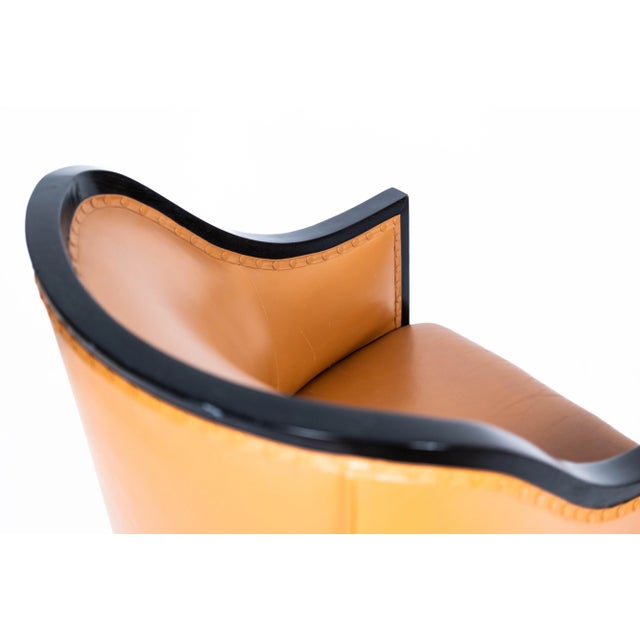 Cognac colored leather upholstery, brass shoes