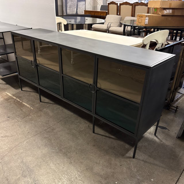 Design Plus Gallery presents the Rockaway Sideboard from Four Hands. This industrial-inspired cabinet pairs a distressed...