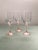 A beautiful trio of pastel stemmed wine glasses in a simple elegant design.