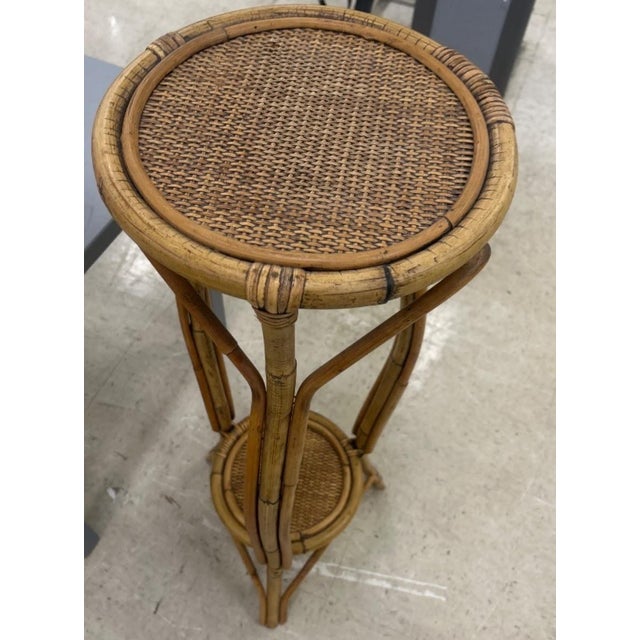 Bring a gorgeous touch of natural boho-chic texture into your space! This vintage mid-century modern rattan and bentwood...