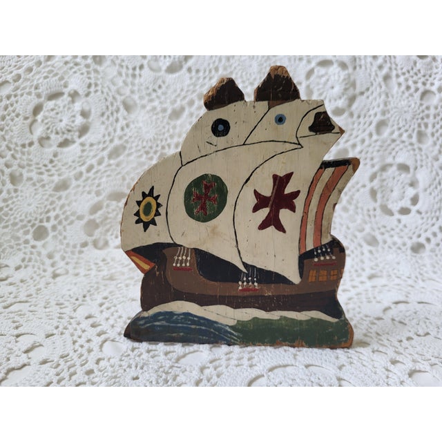A hand painted wooden and metal ship bookend, perfect for a coastal home. Measuring 7” h x 6” w x 3 ¼”, this beauty would...