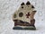 A hand painted wooden and metal ship bookend, perfect for a coastal home. Measuring 7” h x 6” w x 3 ¼”, this beauty would...