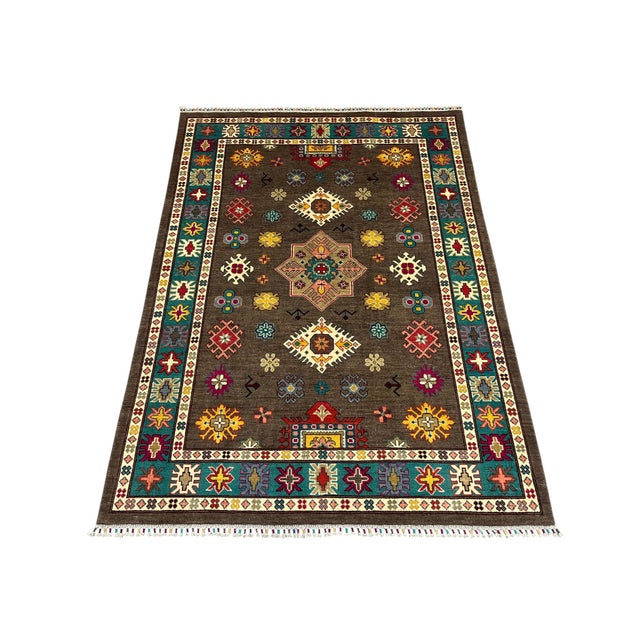 This Kazak-style tribal area rug pairs a rich brown field with a vivid teal border. A central star medallion is surrounded...