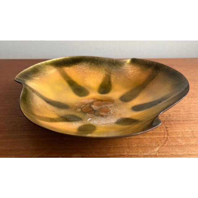 Snazzy Bovano trinket tray in a bright yellow and gold tones with organic body shape. Designed with enamel on copper....