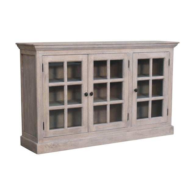 This display cabinet showcases artisanal character through its labor-intensive caustic wash, creating a weathered, stone-...