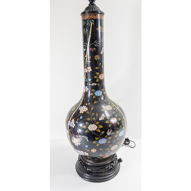 We are selling this very pretty Chinese cloisonne enamel vase. This vase has great size with decoration of floral scrolls...
