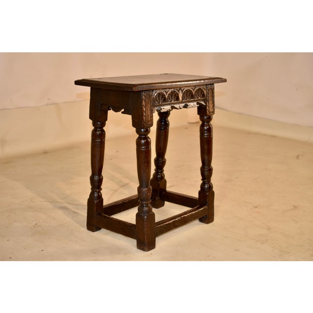 PERIOD 17th century Jacobean oak joint stool from England. The top of the stool has a hand routed banding around the top,...