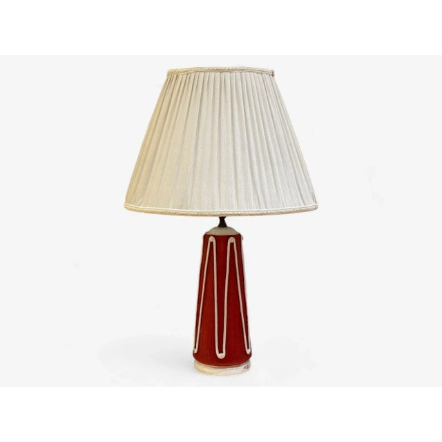Italian Mid-Century Modern, Red Ceramic, Table Lamp, Italy, 1950s A reeded unglazed red ceramic table lamp, likely...