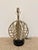 Stylish Currey & Co Deco Sphere Lamp Nickel Finish on round marble base. Sculptural sphere body. Showroom floor sample.