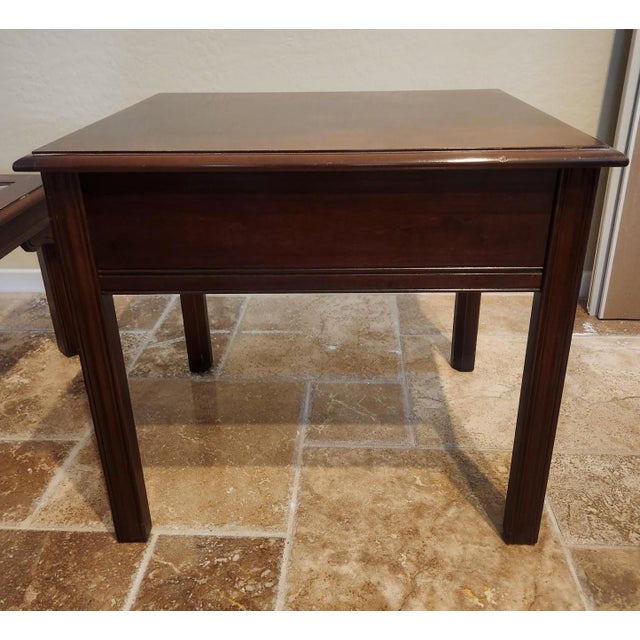 An exceptional vintage end table by Drexel Heritage. Executed in the classic Chippendale style, this is crafted from high-...